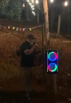 a man standing next to a green traffic light at Bambus Alley in Wayanad