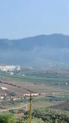 a view of a field with a pole at Noori Home Stay - 2BH in 1st Floor Near Ooty in Ooty