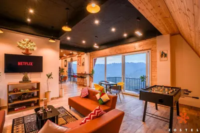 a living room with a couch and a table at Zostel Kodaikanal, Vilpatti in Kodaikānāl
