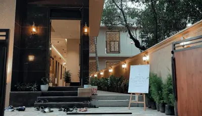 a building with stairs and a sign in front of it at French Boulevard in Mahe