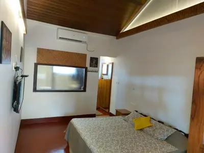 a bedroom with a bed and a window in it at 36 Palms Heritage Villa in Cochin