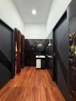 a room with a hallway with a vanity and a mirror at Horegallu Homes in Agali