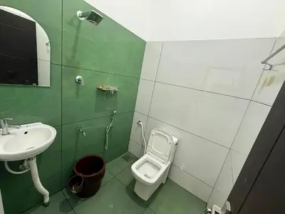 a bathroom with a sink and a toilet at Horegallu Homes in Agali