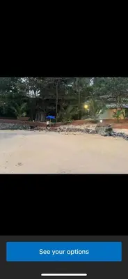 a black screen with a picture of a tennis court at Rocks beach house in Kannur