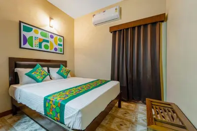 a bedroom with a bed in a room at Treebo Dunag in Coimbatore