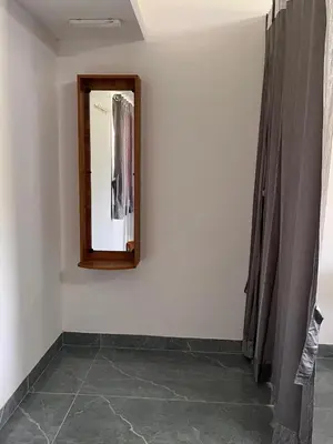 a mirror on a wall in a room at The coconest Kinathukadavu, Coimbatore in Kinattukkadavu