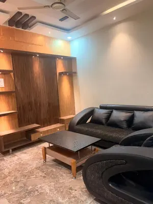 a living room with a couch and a table at The Green residence in Mysore