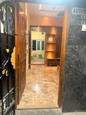 an open door to a room with a hallway at The Green residence in Mysore