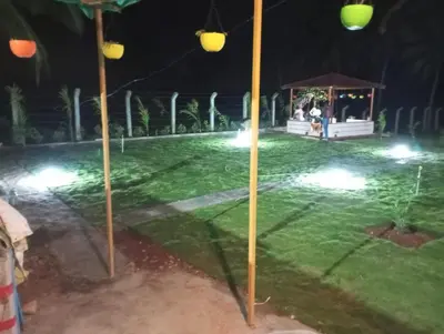 a park at night with a gazebo at Friendly homestay in Mysore