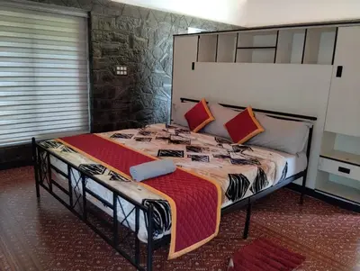 a bedroom with a large bed in a room at Moonrise Valley Freshwave Resorts Pvt Ltd in Koroth