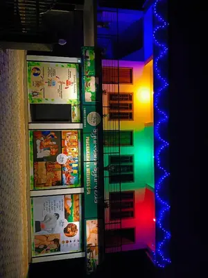 a refridgerator with a colorful display of food at Anna rooms in Chekadi