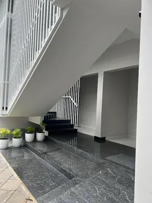 a staircase with potted plants in a building at Star Guest House