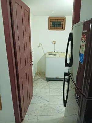 an open door to a bathroom with a sink at Shield Guest Accommodation in Pudunagaram