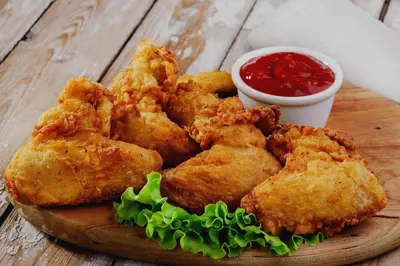 a plate of fried food with dipping sauce on a table at Palette Serenity by CheckIn | 2 BHK Apartment | Coimbatore in Coimbatore