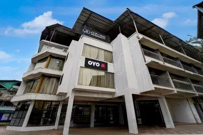 an apartment building with an otc sign on it at Hotel O OZONE Residency in Kozhikode