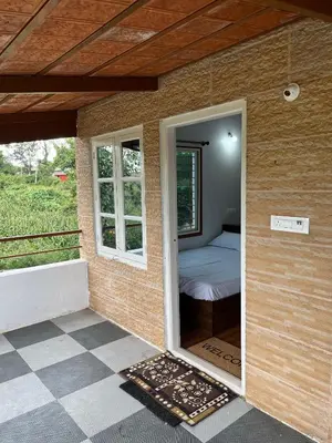 a small room with a bed and a window at S R Retreat in Dodbelvangala