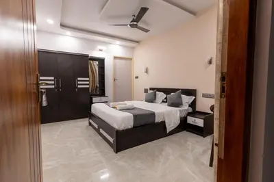 a bedroom with a bed and a ceiling at Coorg Tranquil Retreat in Madikeri