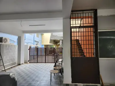 an open door to a room with a kitchen at VPM Homestay in Coimbatore
