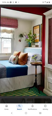 a bedroom with a bed and a table at North star in Mysore