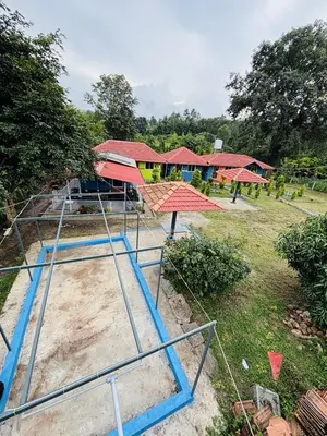 an overhead view of a batting cage in a park at Coorg Sunrise Cottage Homestay in Kushālnagar