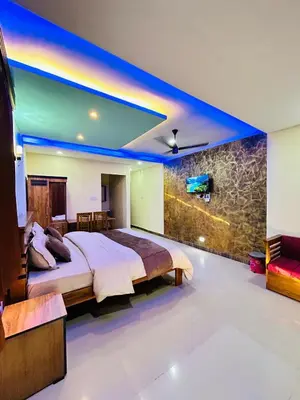 a bedroom with a king sized bed in a room at Private Pool Villa by Green View in Vythiri