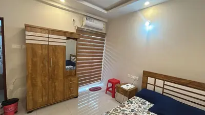 a bedroom with a bed and a closet in it at Divin Le Divine 150 meter to temple in Guruvāyūr