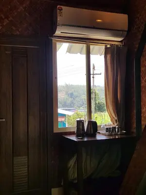 a window in a room with a view at Tusker Valley Bamboo Room Mudumalai by Privacy Homes in Mudumalai National Park
