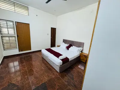 a bedroom with a bed in a room at LUXE Penthouse 4BHK with Swimming pool in Mysore