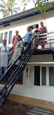 a group of people standing on top of a building at kadalundi Heritage in Vallikunnu