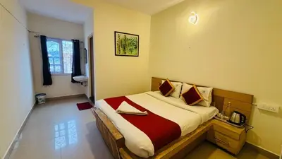 a bedroom with a large bed in a room at VR Residency in Ooty