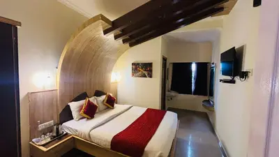 a bedroom with a large bed in a room at VR Residency in Ooty