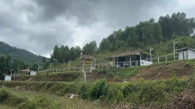 a building on the side of a hill at Mystic Valley Vattavada in Vattavada