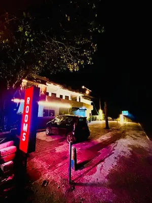 a car parked in a parking lot at night at Wild Bliss in Sultan Bathery