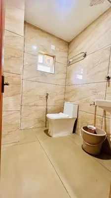 a bathroom with a toilet and a sink at Wild Bliss in Sultan Bathery