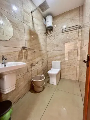 a bathroom with a toilet and a sink at Wild Bliss in Sultan Bathery