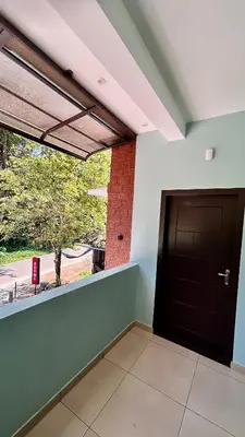 a room with a door and a window at Wild Bliss in Sultan Bathery