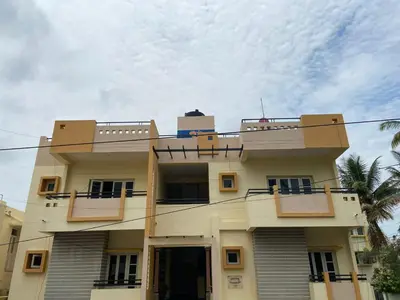 a building with two balconies on top of it at Mulberry Bay Serviced Apartments in Mysore