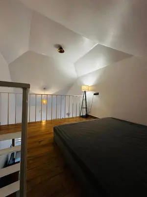a bedroom with a bed and a balcony at ThunderHill by Casablanca - A Premium Pool Villa in Meenangadi