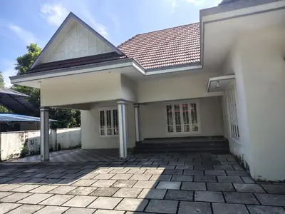 a white house with a roof and a patio at Oriyon villa in Kāladi
