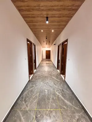an empty hallway in a building with a wooden ceiling at Soul Stay in Munnar