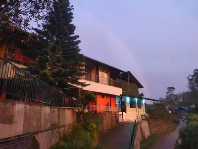 a house with lights on the side of it at Soul Stay in Munnar