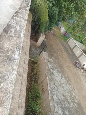 an overhead view of a retaining wall with a fence at Shield Guest Accommodation in Pudunagaram
