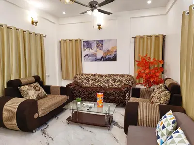 a living room with two couches and a table at Casa de Shalom - 3 Bedroom AC Villa 65