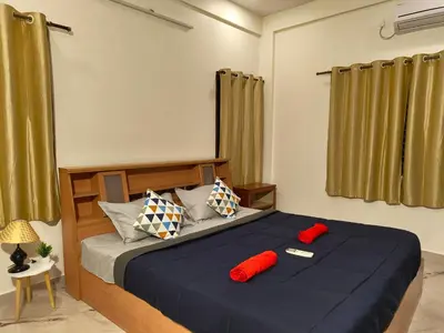 a bedroom with a bed with red pillows on it at Casa de Shalom - 3 Bedroom AC Villa 65