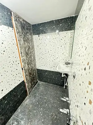 a bathroom with a shower with a sink at Bhargavi homes in Coimbatore