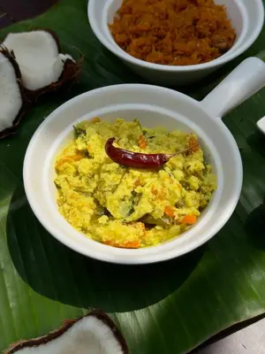 a bowl of omelet on a green leaf at Chetty's Mane by Raho - Estate-View Heritage Stay in Siddapur