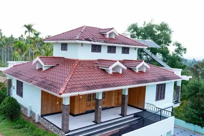 an overhead view of a house with a red roof at Midnight Oasis Wayanad in Meenangadi