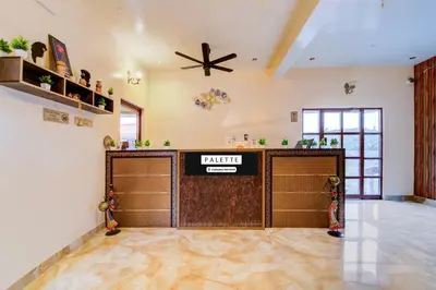 a garage with a pair of garage doors in a room at Palette Peace Village by CheckIn | Garden | Breakfast | Erode in Erode