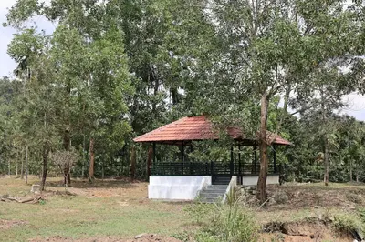 a gazebo in a field with a tree at Aquatica by bough'n villa in Kenichira
