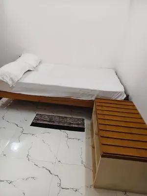 a bed sitting on top of a box at krishna paadham in Guruvāyūr